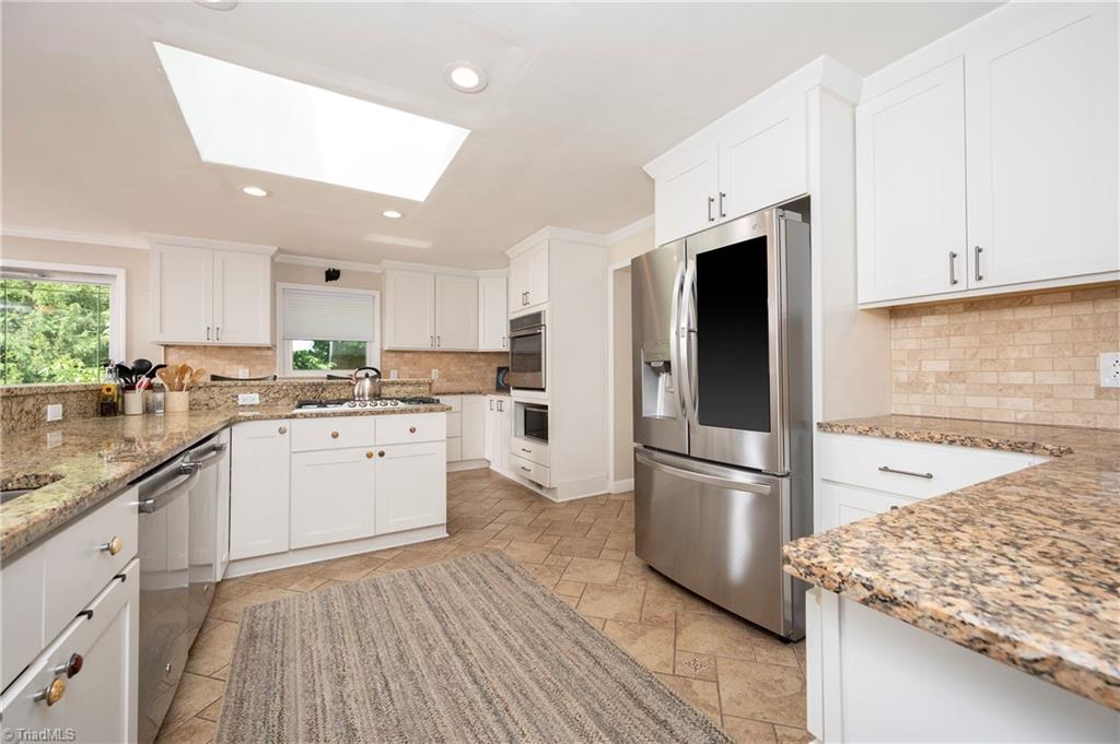 2164 Beckner Road Lexington, NC 27292 - Photo 31 of 50 Kitchen with granite, gas cooktop and notice it as two dishwashers