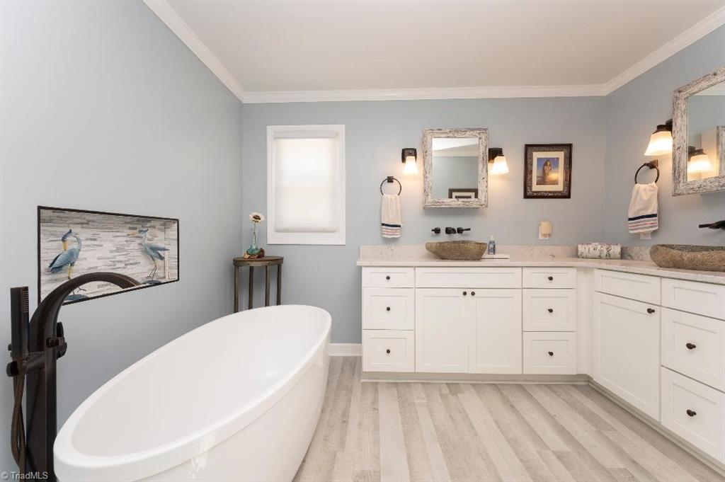 2164 Beckner Road Lexington, NC 27292 - Photo 39 of 50 Primary bath with tons of counter space, his and her sinks and a modern bath tub with oil rubbed bronze fixtures