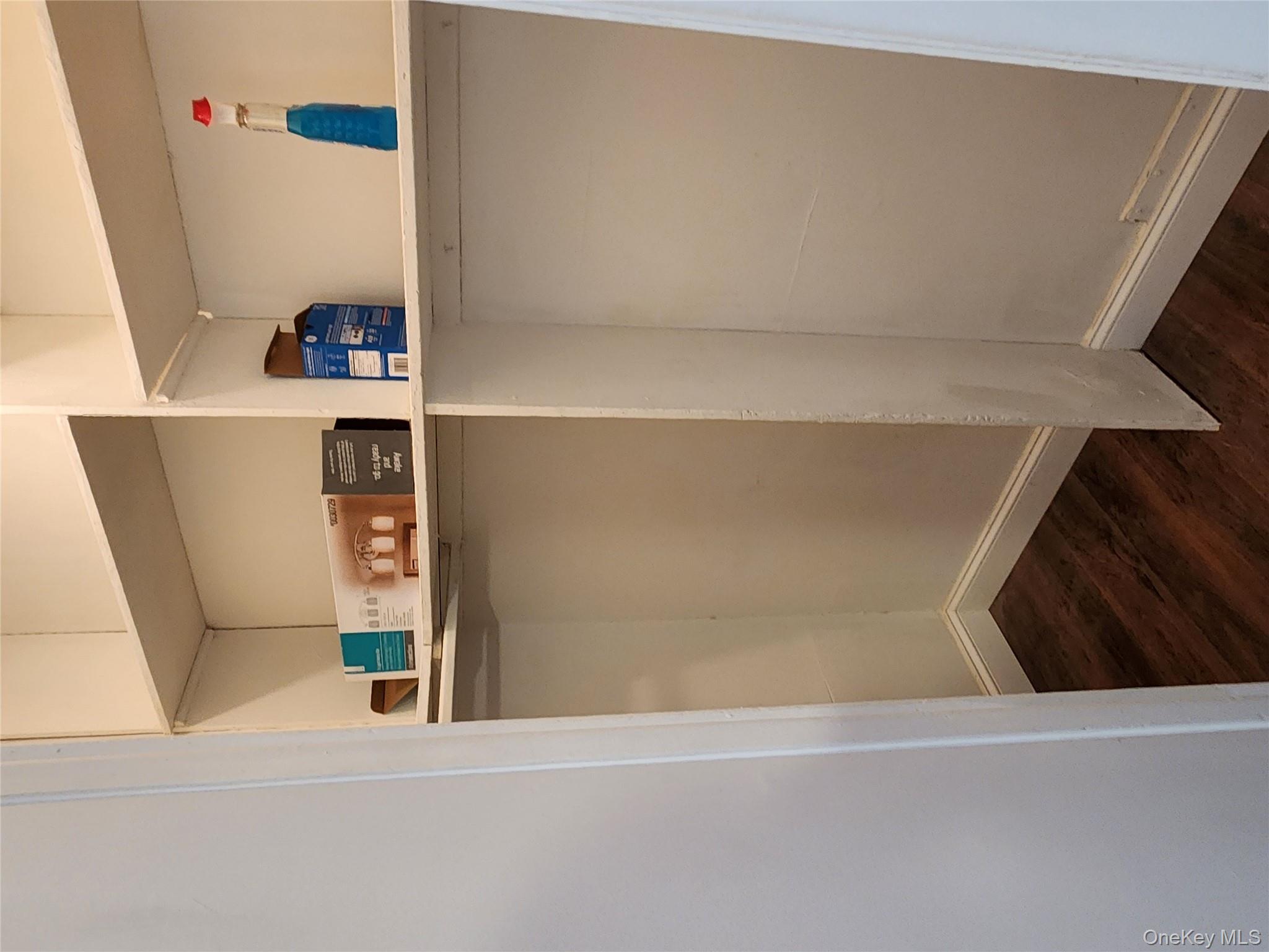 64-10 Myrtle Avenue Queens, NY 11385 - Photo 14 of 15 a view of storage and utility room with wooden floor