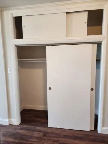 a view of front door with wooden floor