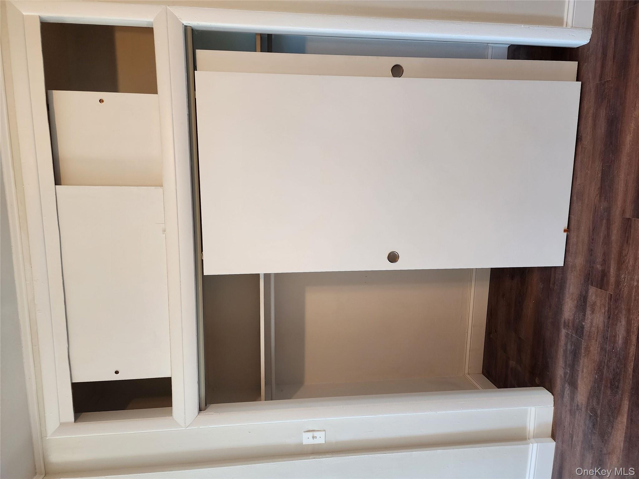 64-10 Myrtle Avenue Queens, NY 11385 - Photo 15 of 15 a view of front door with wooden floor