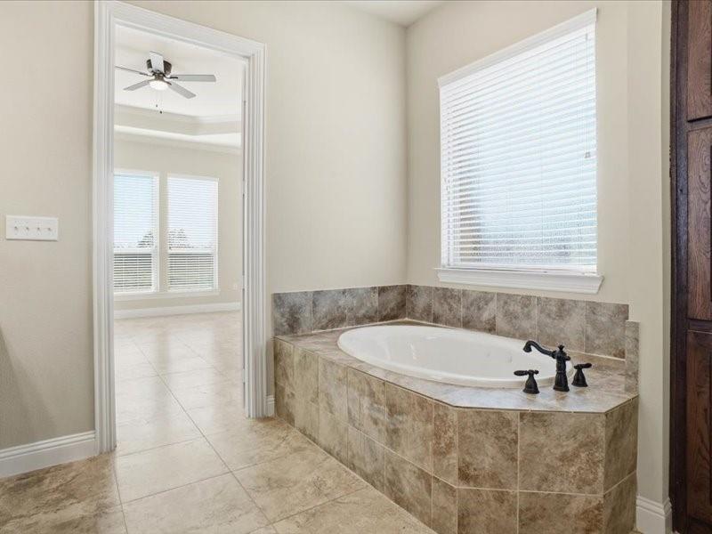4021 West J E Woody Road Springtown, TX 76082 - Photo 24 of 37 Large Garden Tub in Master bathroom