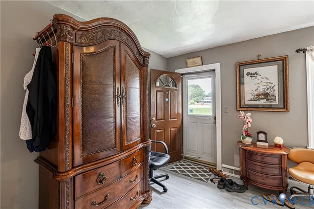 a view of closet with wooden floor