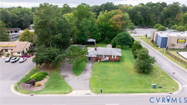 an aerial view of a house with outdoor space