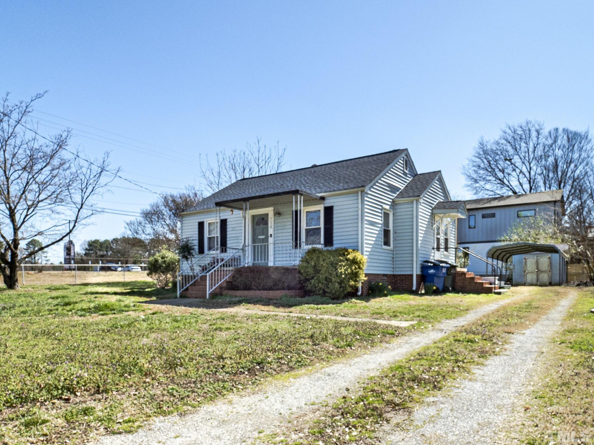 716 Hamilton Road Raleigh, NC 27604 - Photo 1 of 15 a front view of a house with a yard