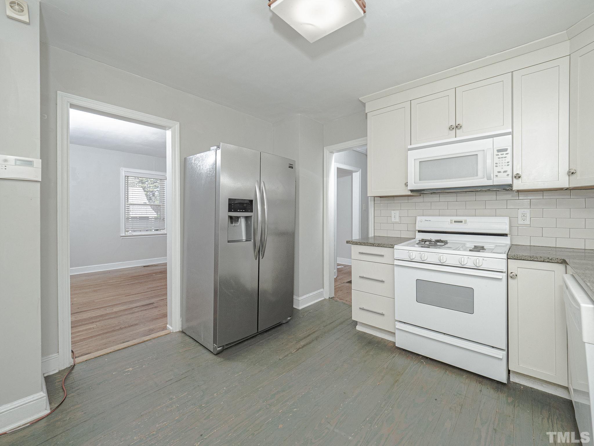 716 Hamilton Road Raleigh, NC 27604 - Photo 9 of 15 a kitchen with cabinets appliances and a counter space