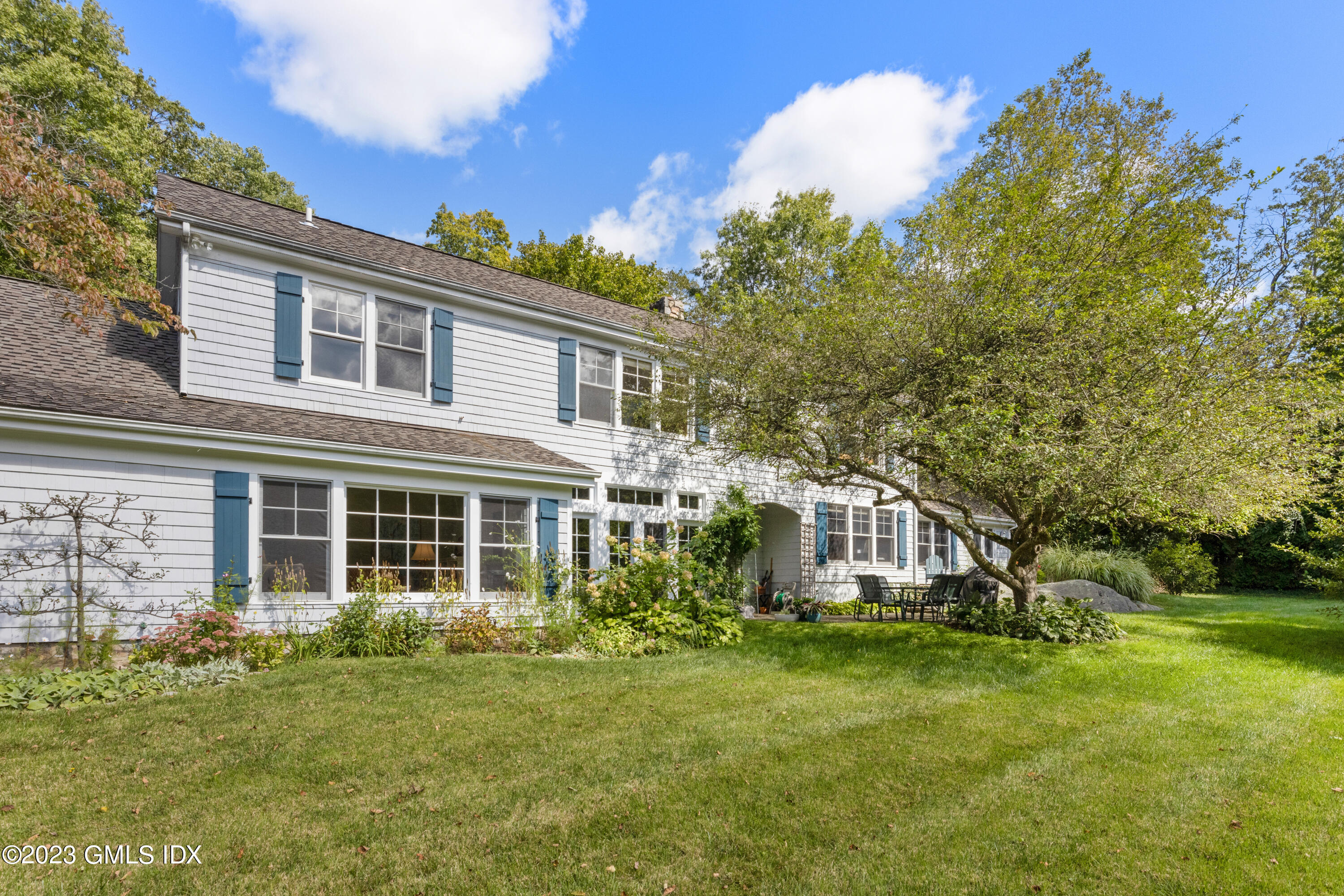 284 Riversville Road Greenwich, CT 06831 - Photo 29 of 34 front view of a house with a yard