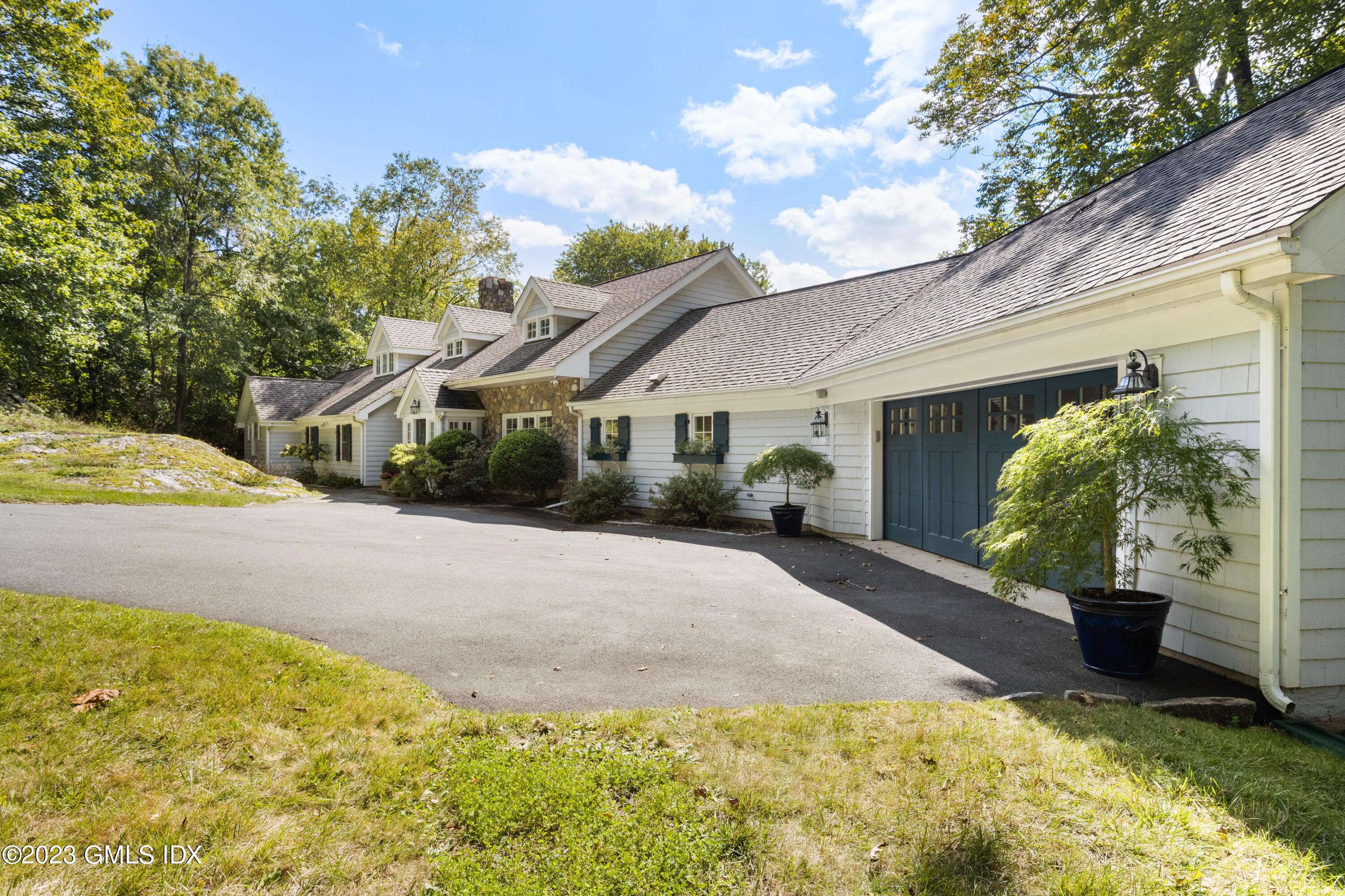 284 Riversville Road Greenwich, CT 06831 - Photo 3 of 34 a view of a house with backyard and garden