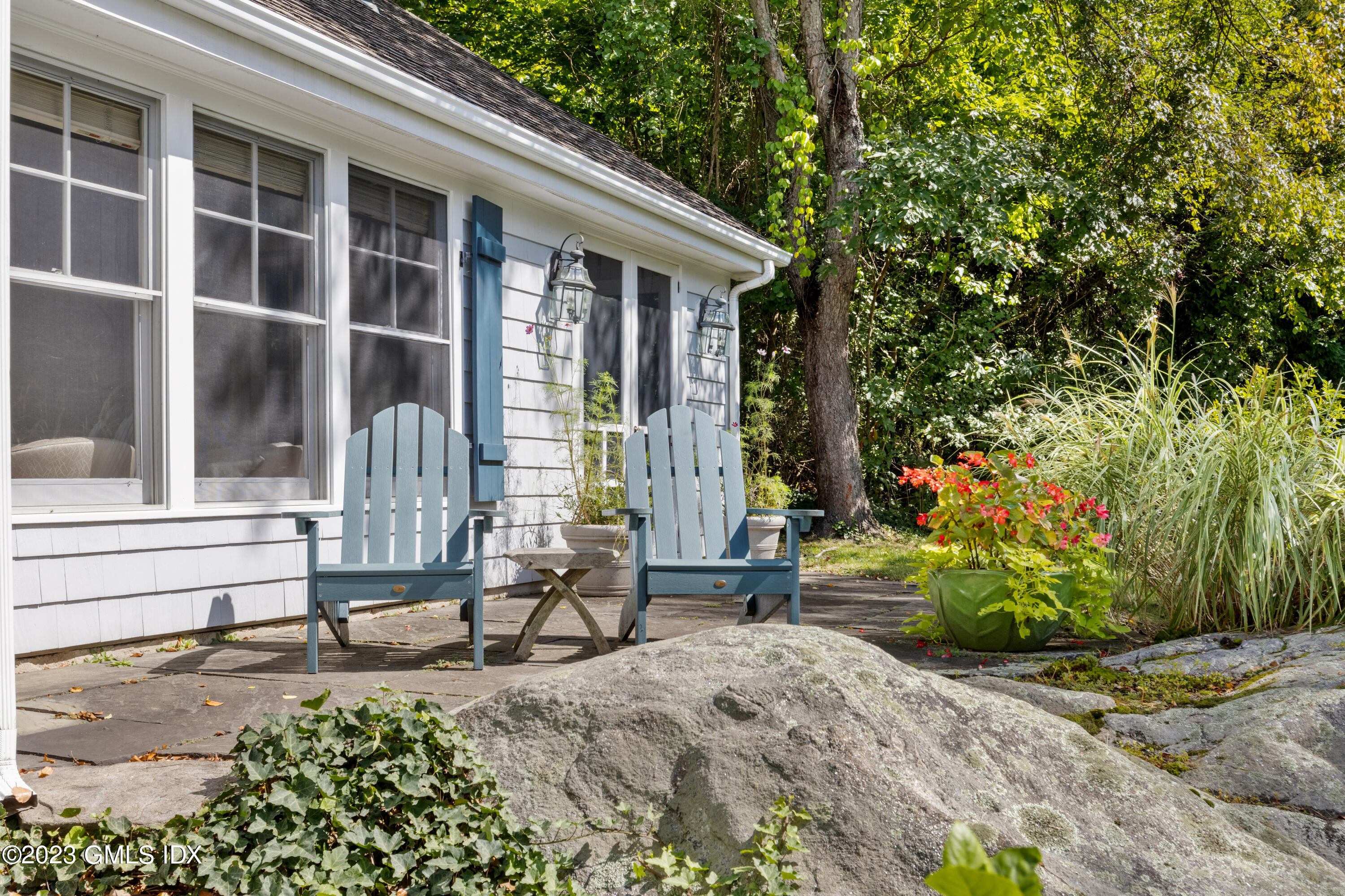 284 Riversville Road Greenwich, CT 06831 - Photo 31 of 34 a view of house with backyard outdoor seating and plants