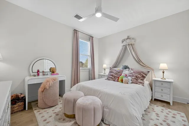a bedroom with furniture and a chandelier