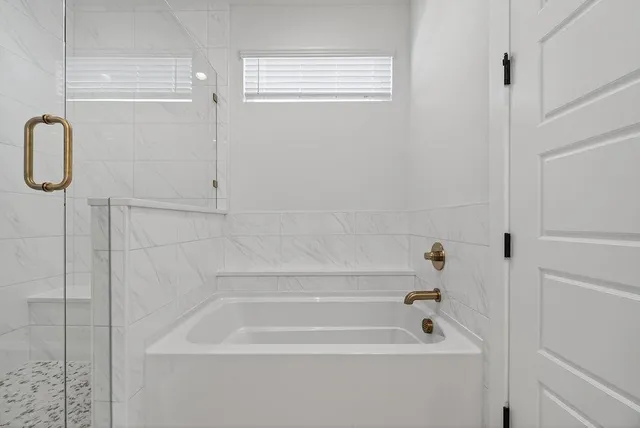 a bathroom with a bath tub