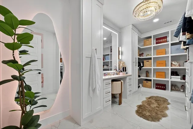a view of kitchen with cabinets and window