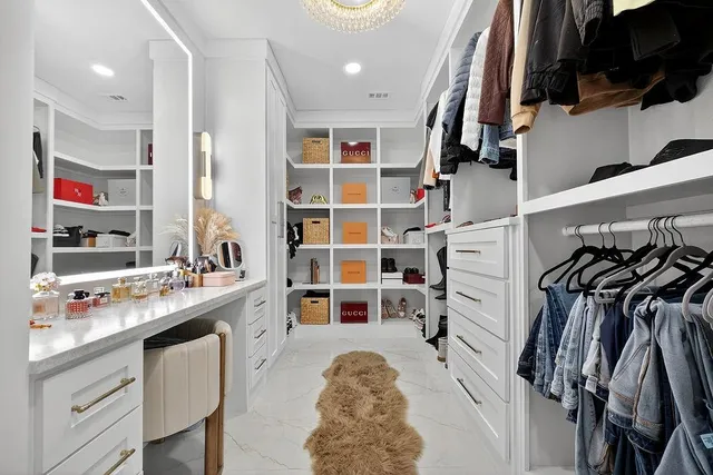 a kitchen with stainless steel appliances a sink and a refrigerator