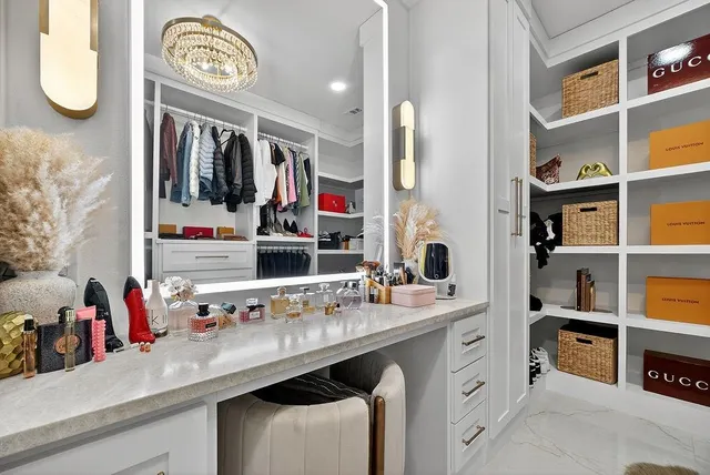 a room with furniture and a kitchen area