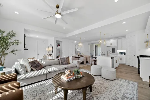 a living room with furniture and a table