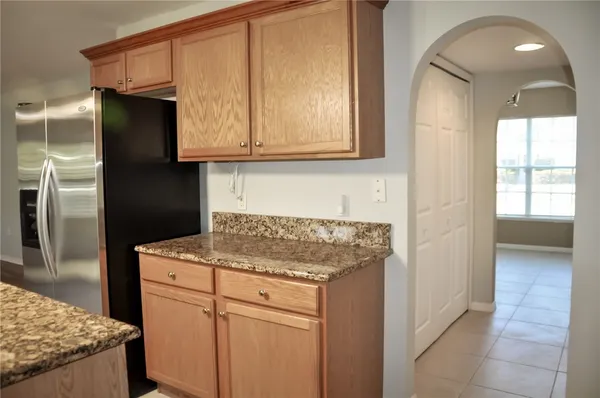 a kitchen with a sink and refrigerator
