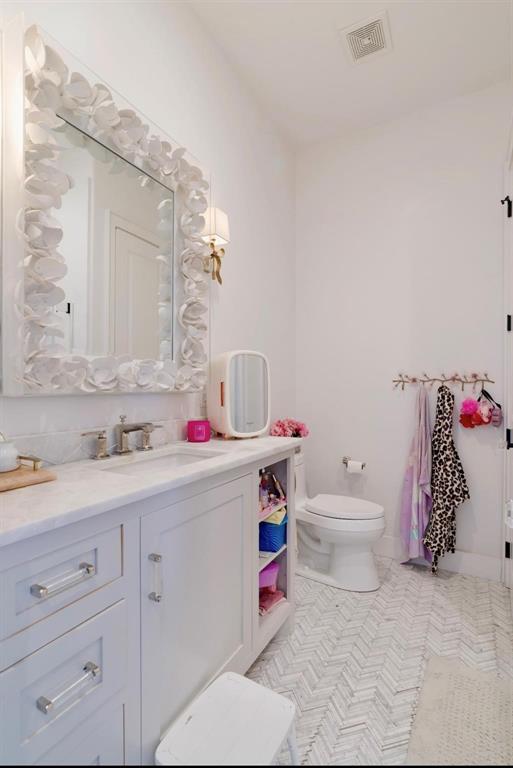 2106 County Road Paris, TX 75462 - Photo 21 of 40 a bathroom with a sink and a toilet