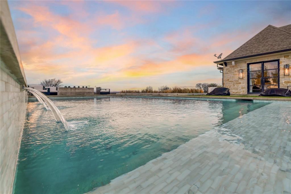 2106 County Road Paris, TX 75462 - Photo 27 of 40 a view of a lake with houses in the back