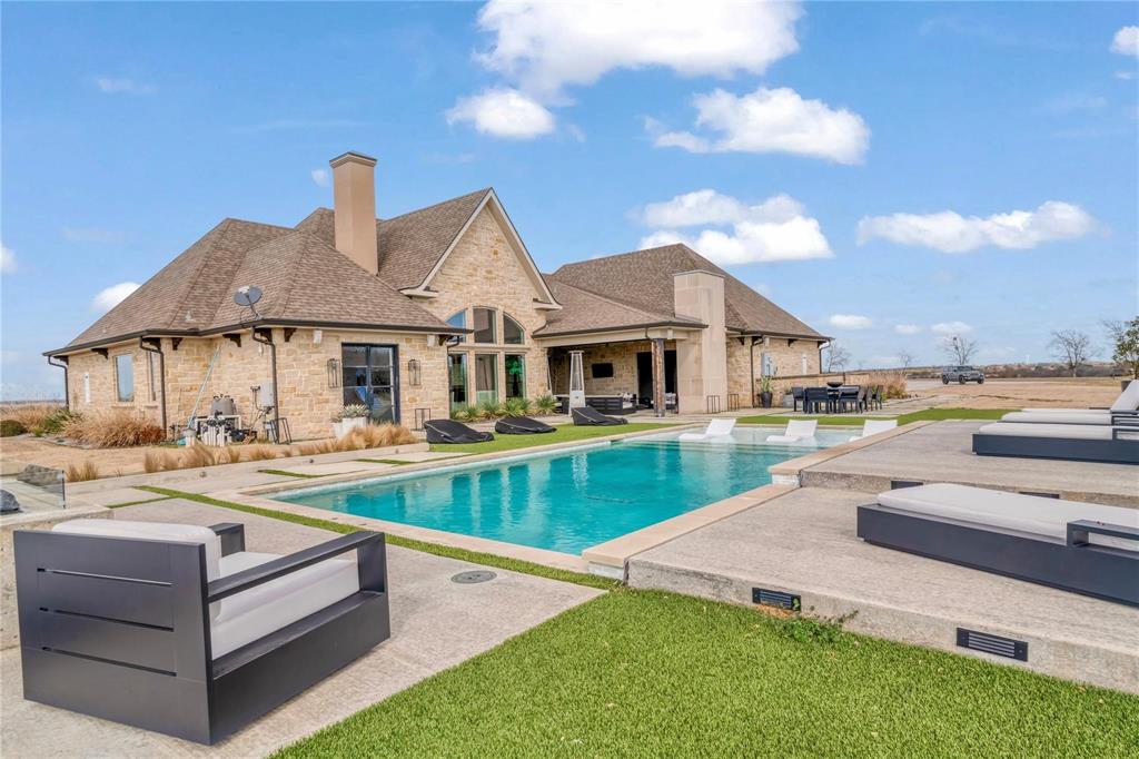 2106 County Road Paris, TX 75462 - Photo 28 of 40 a view of a house with pool table and chairs