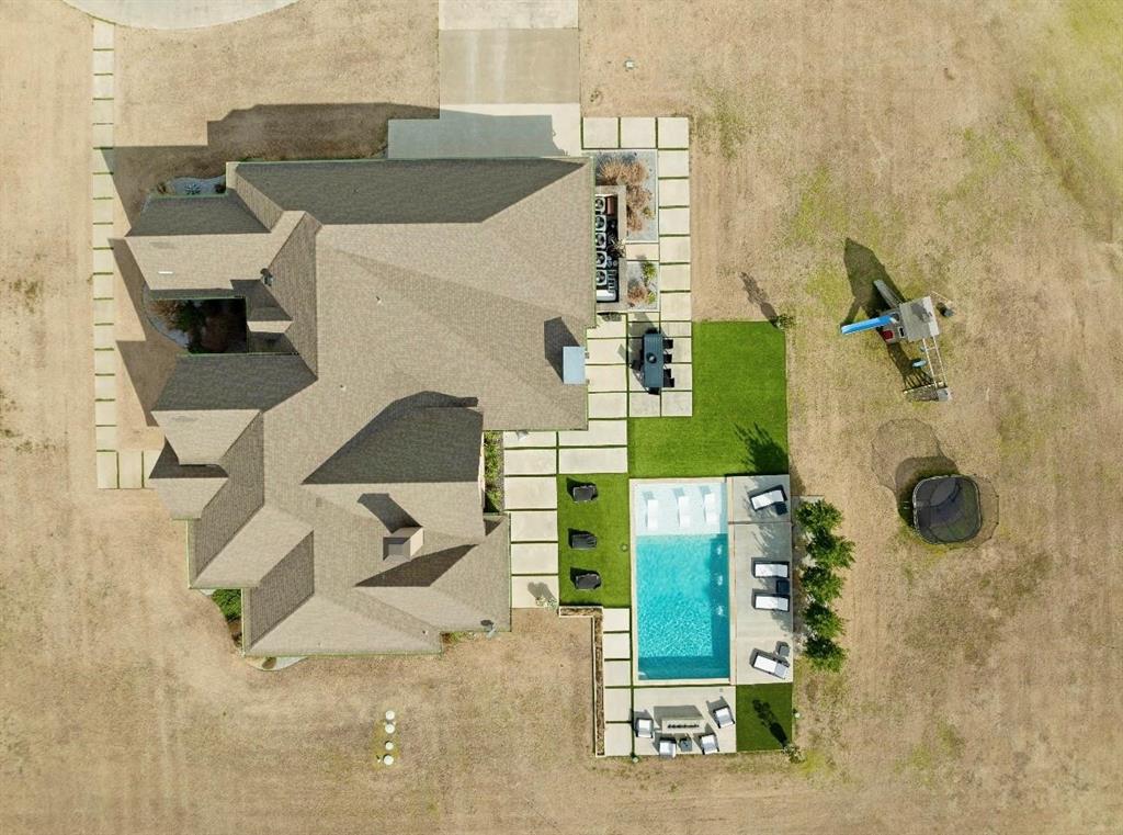 2106 County Road Paris, TX 75462 - Photo 31 of 40 an aerial view of a house with a yard