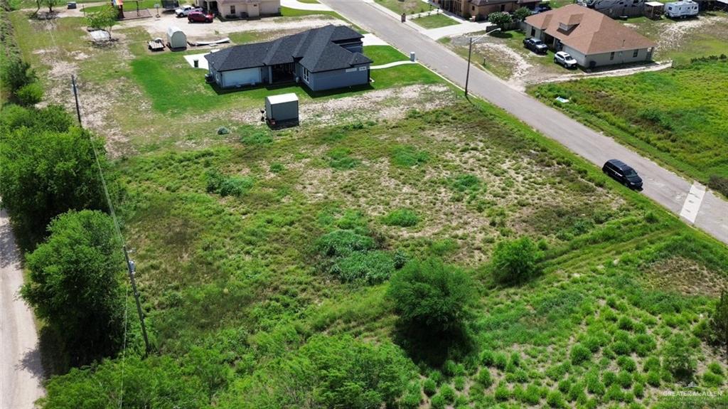 1049 River Bend Street Rio Grande City, TX 78582 - Photo 1 of 2 an aerial view of a house with a yard