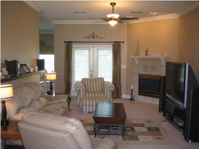 3851 Mesa Road Destin, FL 32541 - Photo 2 of 20 a living room with furniture a fireplace and a flat screen tv