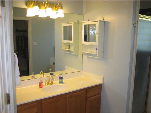 3851 Mesa Road Destin, FL 32541 - Photo 13 of 20 a bathroom with a sink and a mirror
