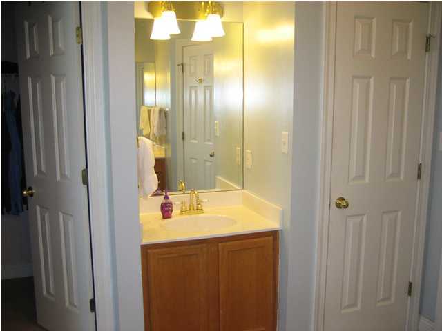 3851 Mesa Road Destin, FL 32541 - Photo 14 of 20 a bathroom with a sink and a mirror