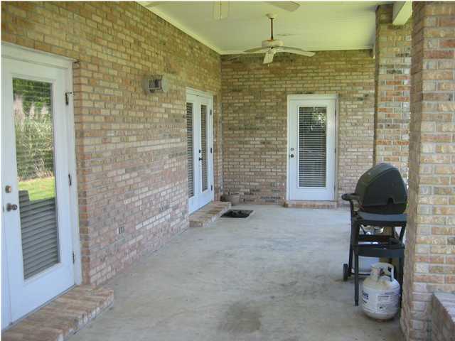 3851 Mesa Road Destin, FL 32541 - Photo 17 of 20 a balcony with chairs and a gate
