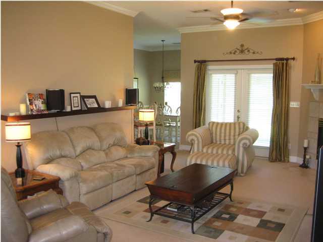 3851 Mesa Road Destin, FL 32541 - Photo 3 of 20 a living room with furniture and a chandelier