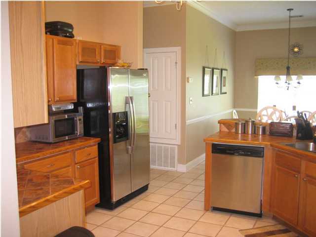 3851 Mesa Road Destin, FL 32541 - Photo 4 of 20 a kitchen with stainless steel appliances granite countertop a refrigerator and a sink