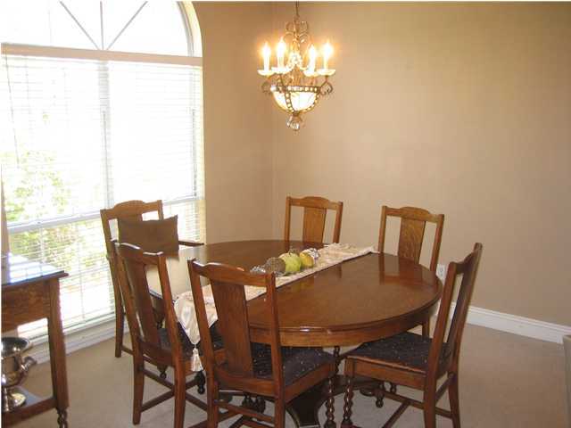 3851 Mesa Road Destin, FL 32541 - Photo 10 of 20 a view of a dining room with furniture and chandelier