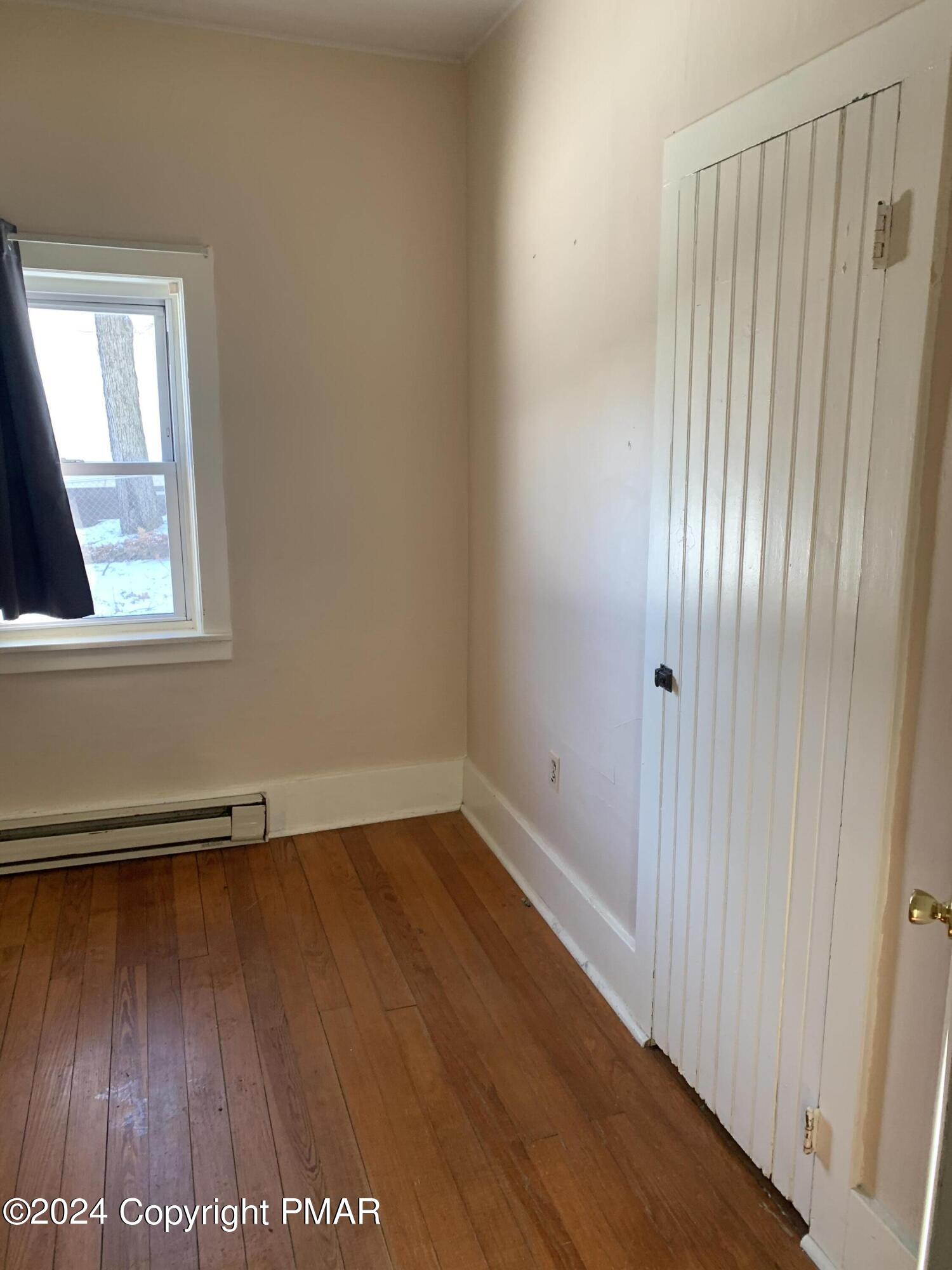 28 Reeder Street Mount Pocono, PA 18344 - Photo 13 of 17 an empty room with wooden floor and windows