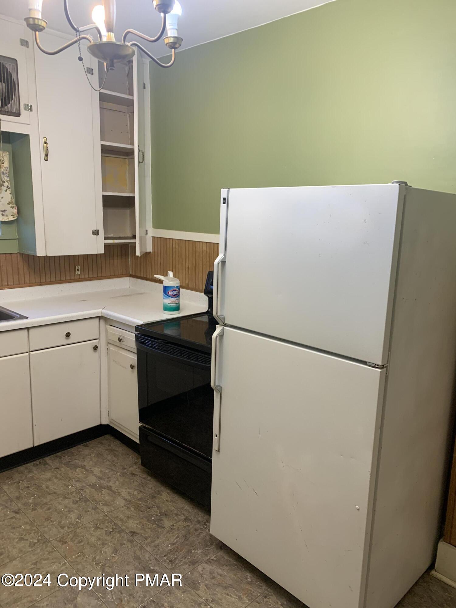 28 Reeder Street Mount Pocono, PA 18344 - Photo 5 of 17 a white refrigerator freezer sitting in a kitchen