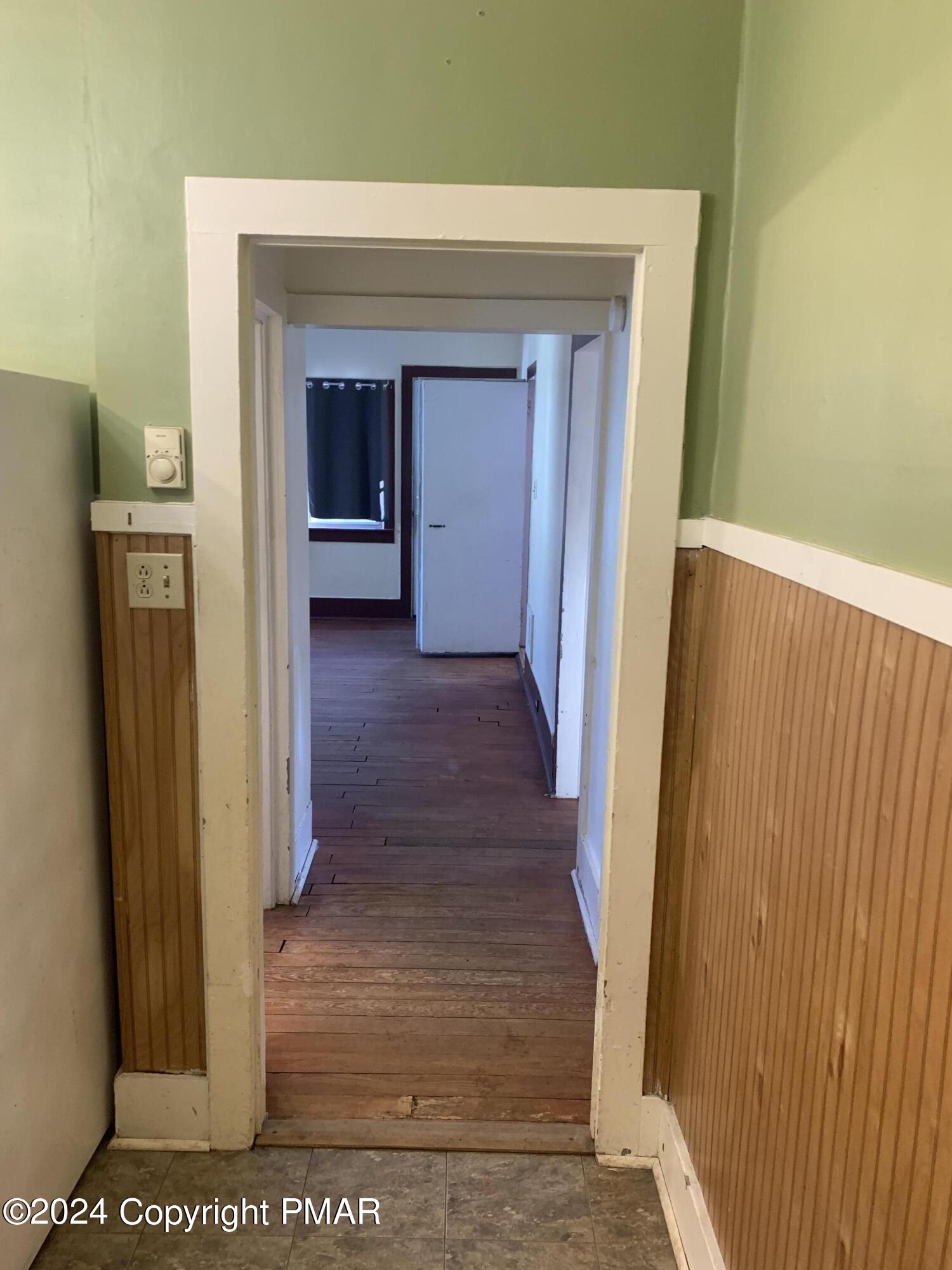 28 Reeder Street Mount Pocono, PA 18344 - Photo 6 of 17 a view of a hallway with wooden floor