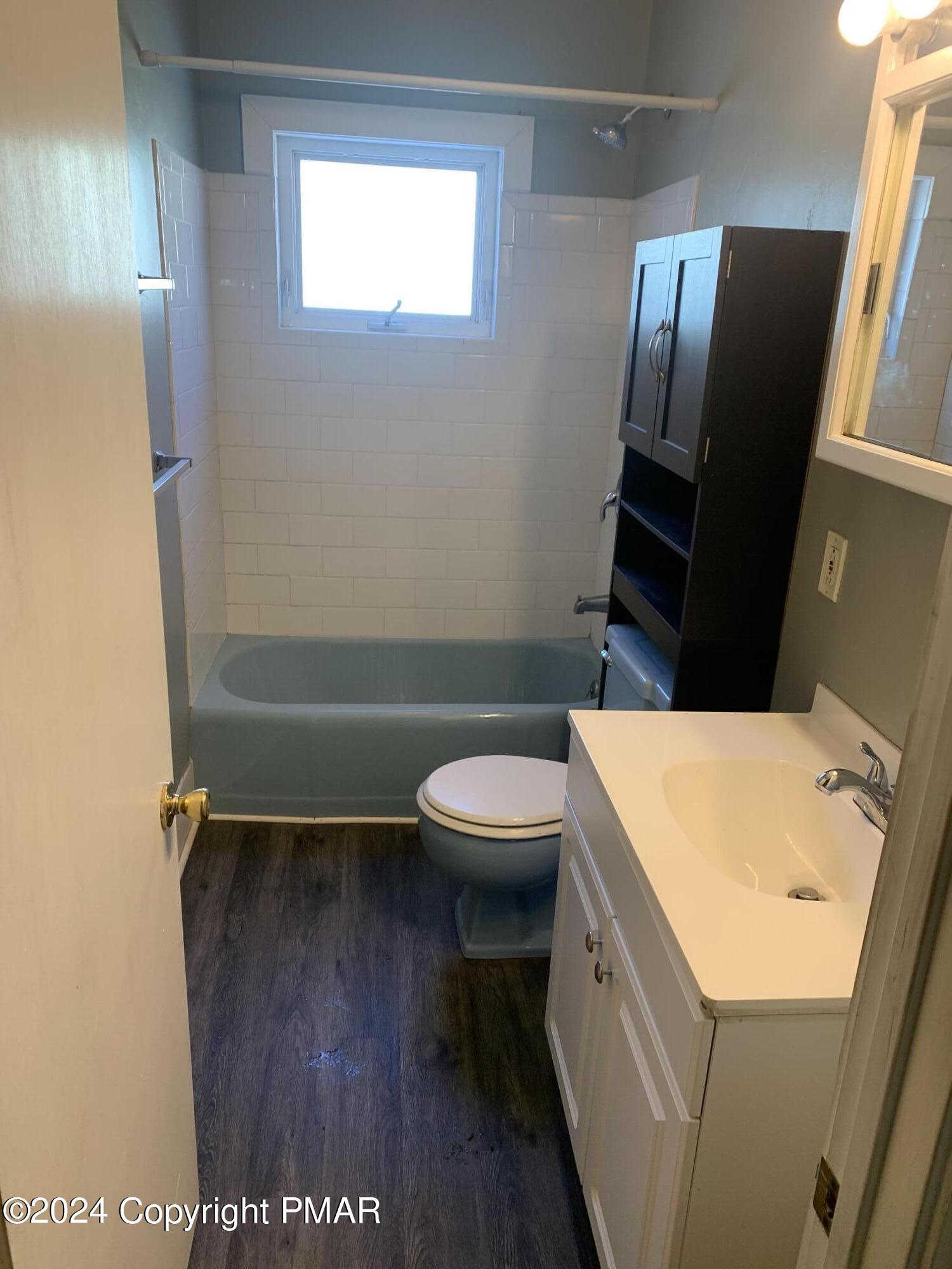 28 Reeder Street Mount Pocono, PA 18344 - Photo 7 of 17 a bathroom with a sink a toilet and a mirror