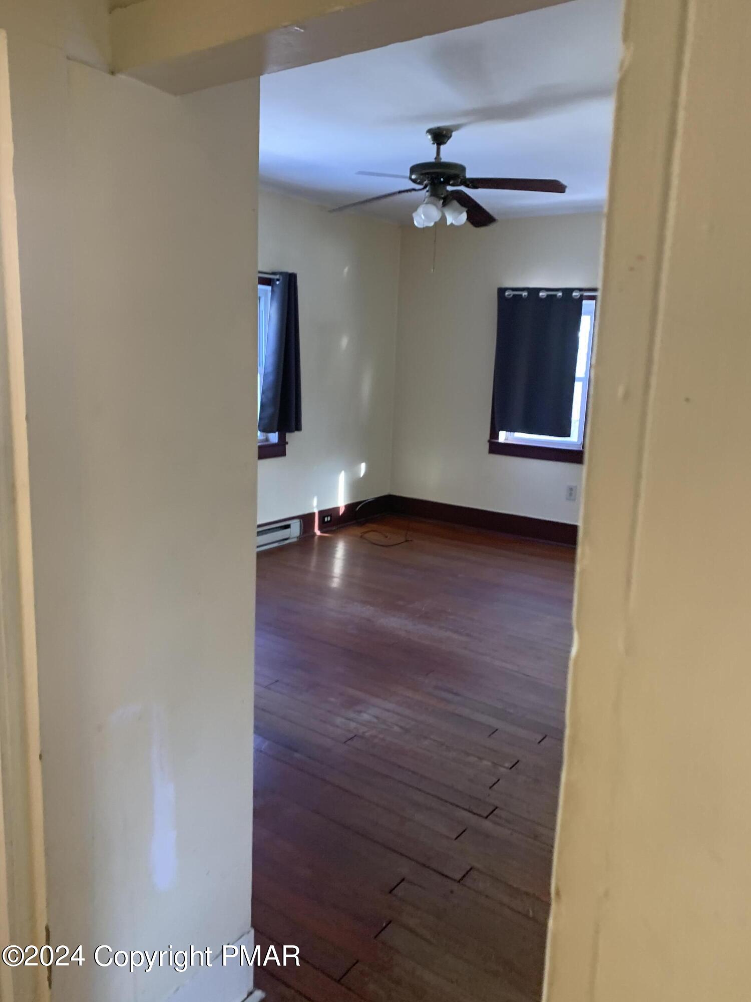 28 Reeder Street Mount Pocono, PA 18344 - Photo 8 of 17 a view of a livingroom with a staircase