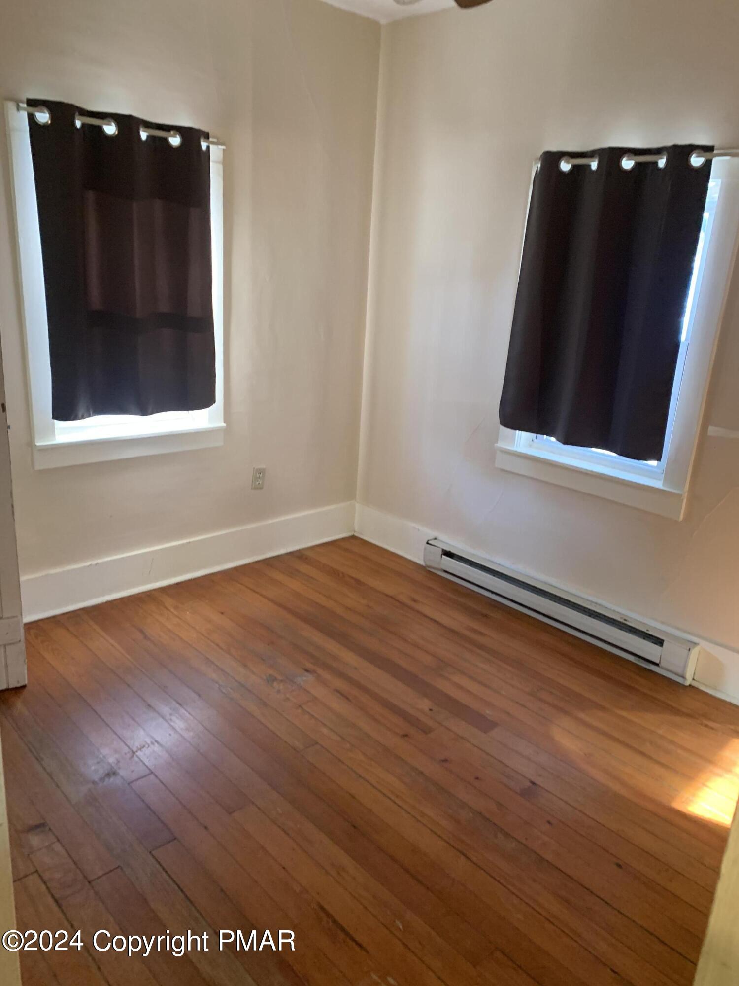 28 Reeder Street Mount Pocono, PA 18344 - Photo 10 of 17 a view of an empty room with wooden floor and a window