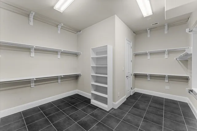 a media room with lots of chairs and a projector screen