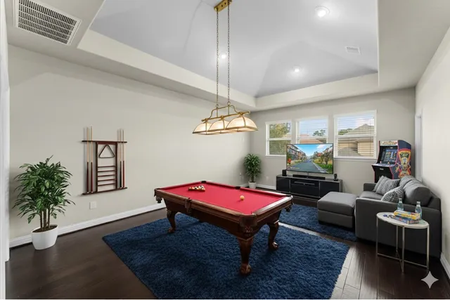 a bathroom with a granite countertop sink toilet mirror and bathtub