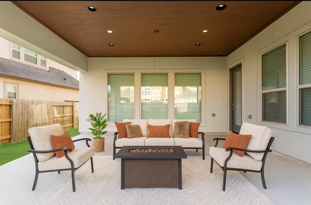 an aerial view of residential house with an outdoor space