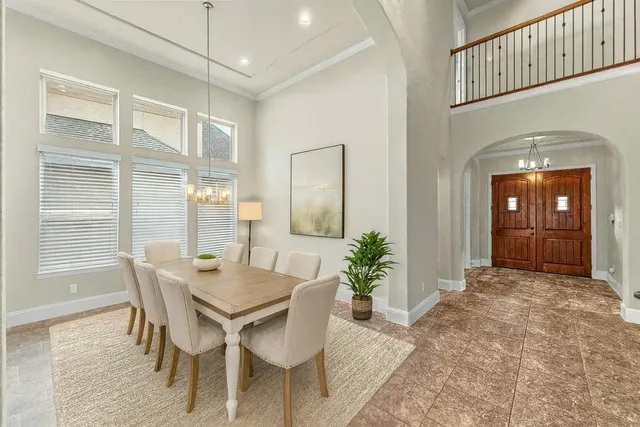 a view of a dining room with furniture and window