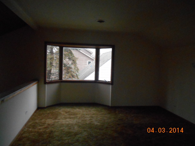 1511 Burr Oak Road Homewood, IL 60430 - Photo 8 of 10 an empty room with a window