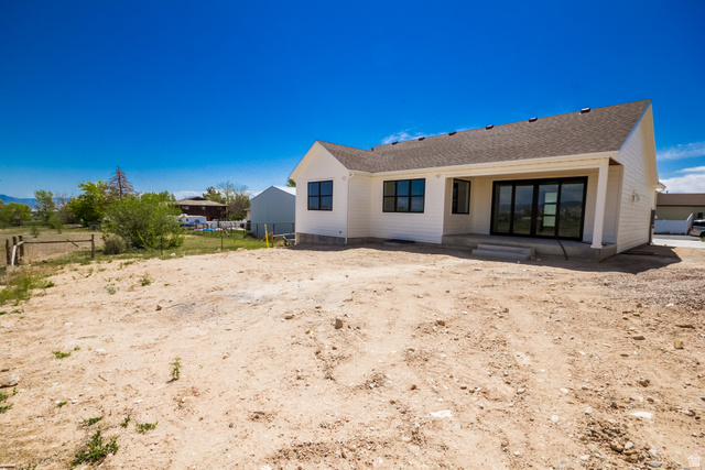 3322 250 S Street Vernal, UT 84078 - Photo 34 of 37 Contemporary white siding exterior with a covered patio