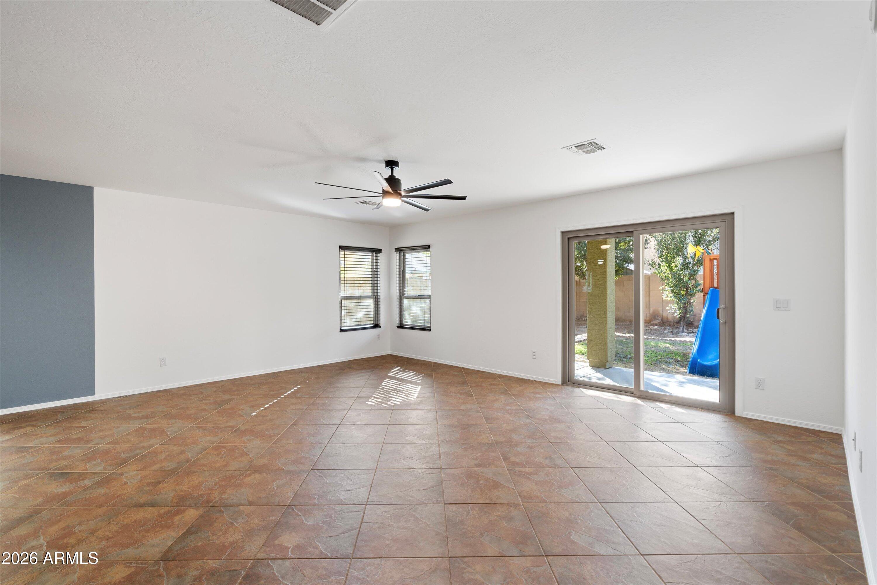 1231 West Ocotillo Street Coolidge, AZ 85128 - Photo 17 of 57 a view of an empty room with windows