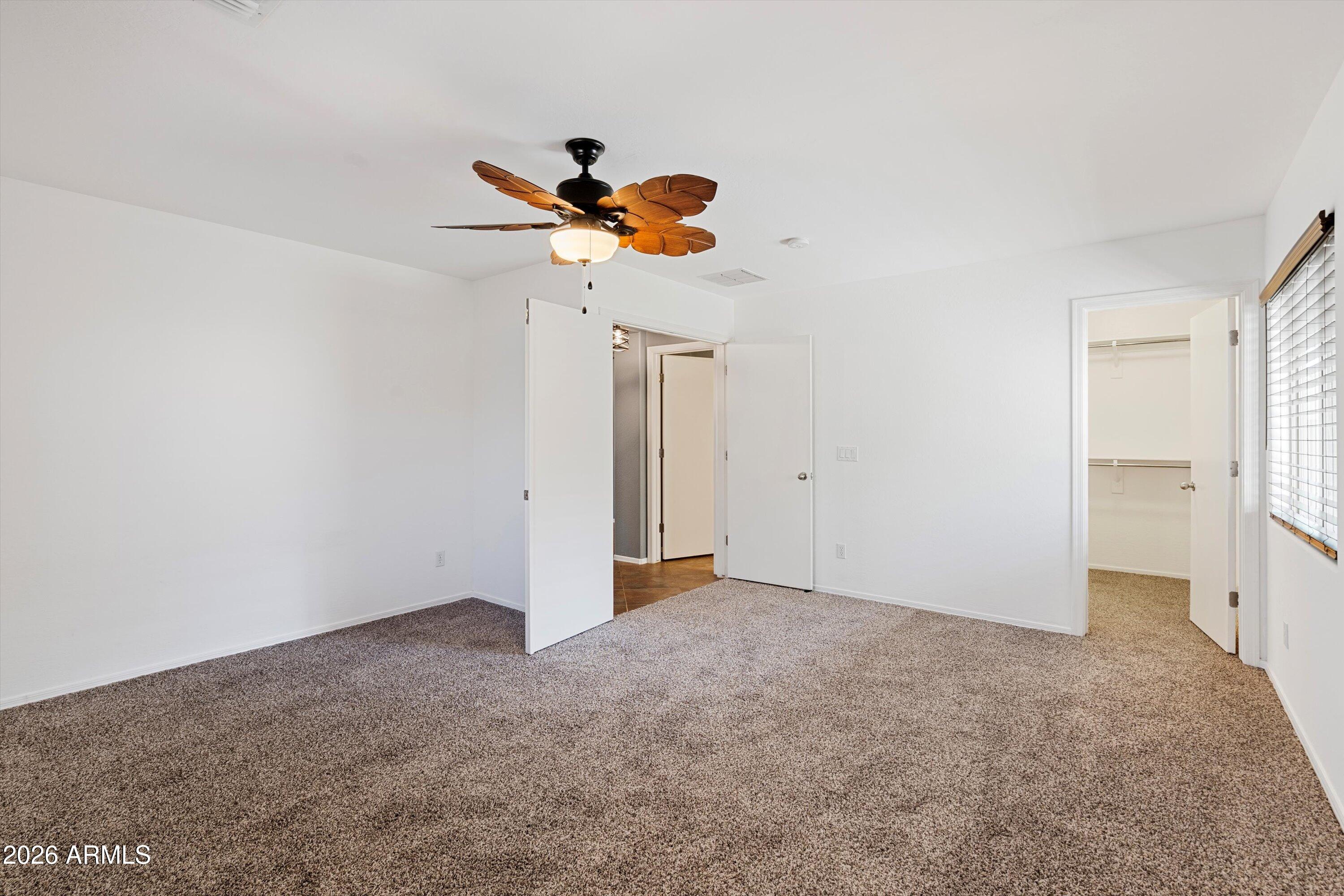 1231 West Ocotillo Street Coolidge, AZ 85128 - Photo 19 of 57 a view of a ceiling fan in a room