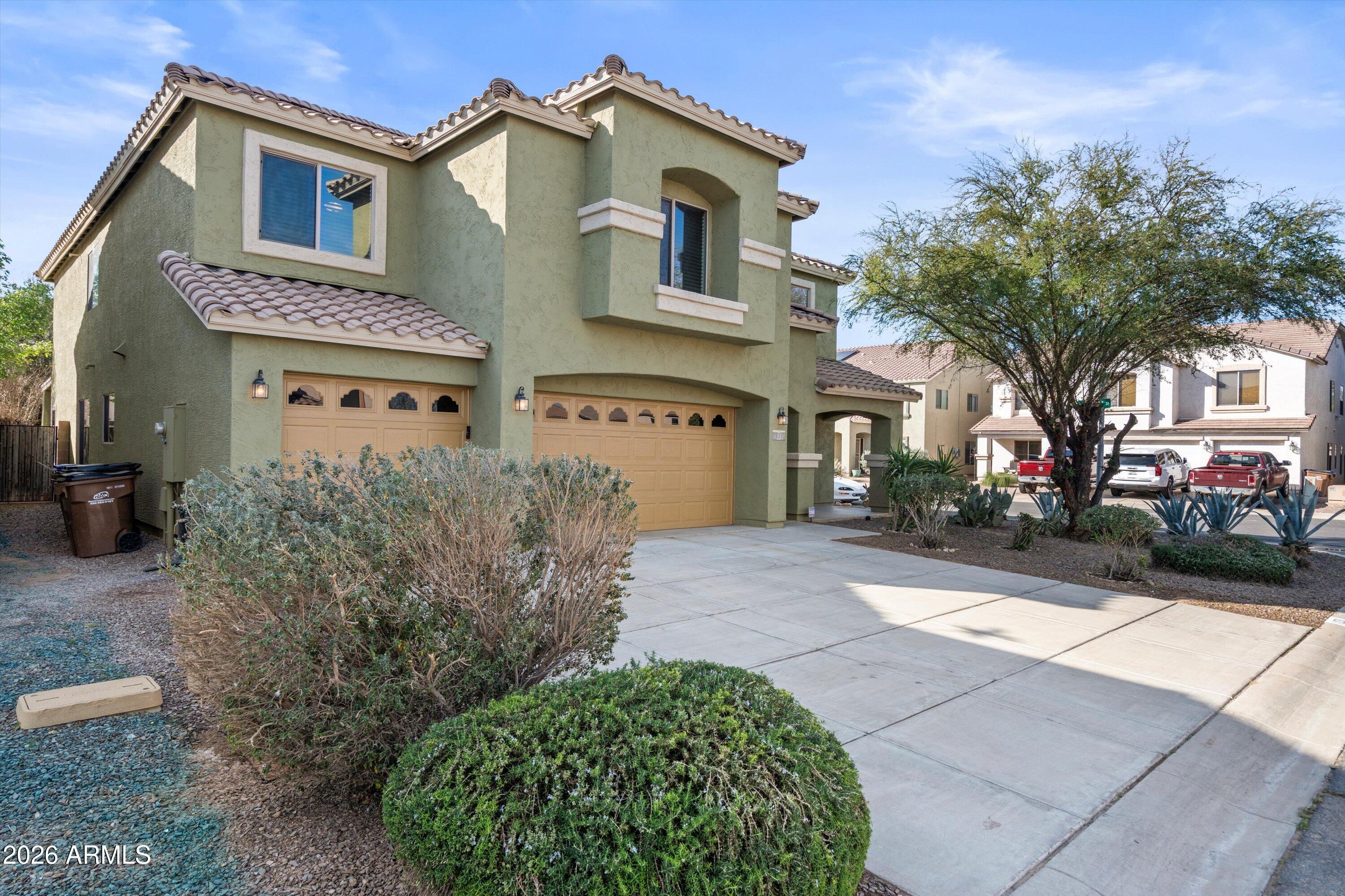 1231 West Ocotillo Street Coolidge, AZ 85128 - Photo 2 of 57 a front view of a house with garden