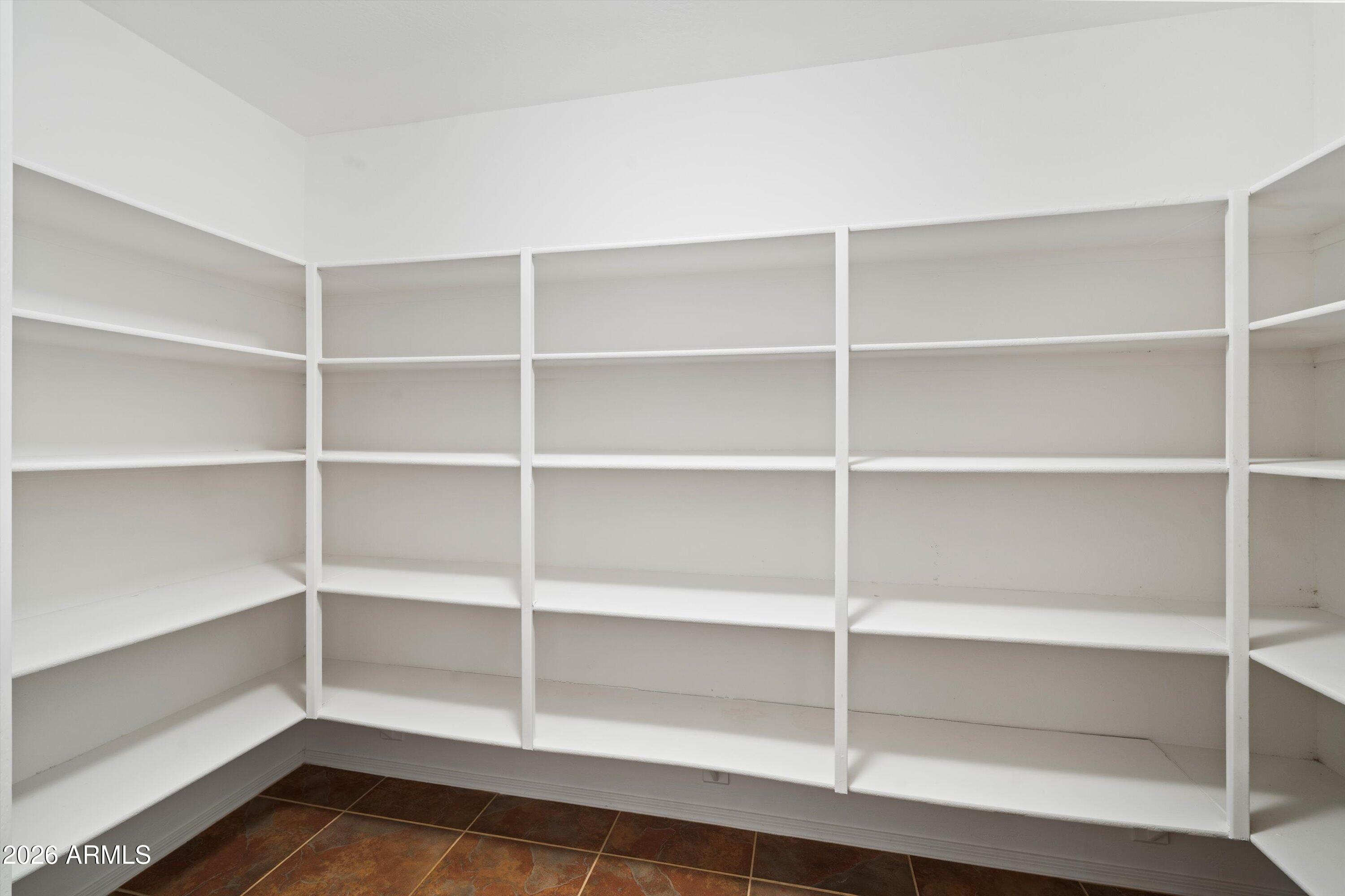 1231 West Ocotillo Street Coolidge, AZ 85128 - Photo 22 of 57 a view of walk in closet with empty racks