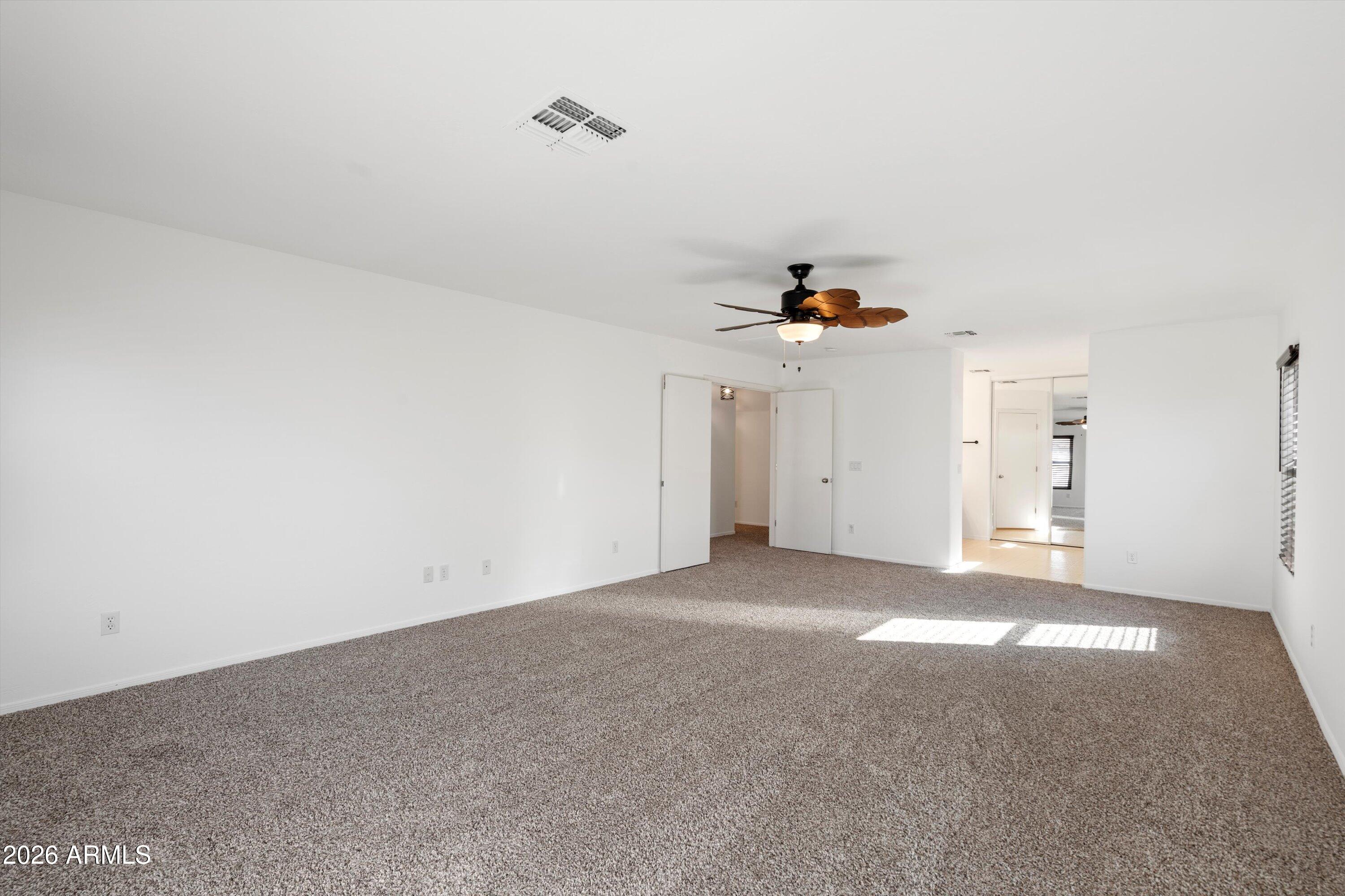 1231 West Ocotillo Street Coolidge, AZ 85128 - Photo 28 of 57 a view of a livingroom and a ceiling fan