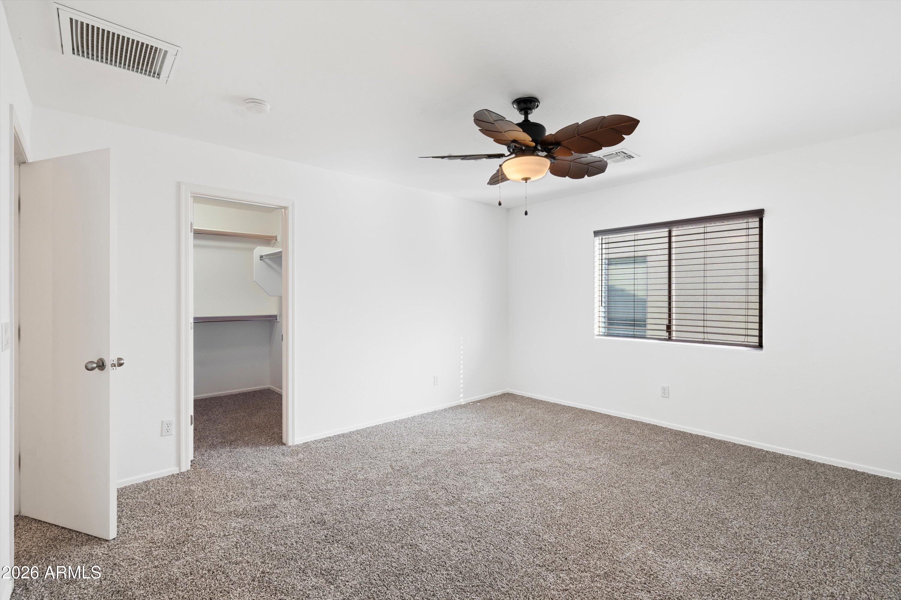 1231 West Ocotillo Street Coolidge, AZ 85128 - Photo 33 of 57 a view of a livingroom with a ceiling fan and window